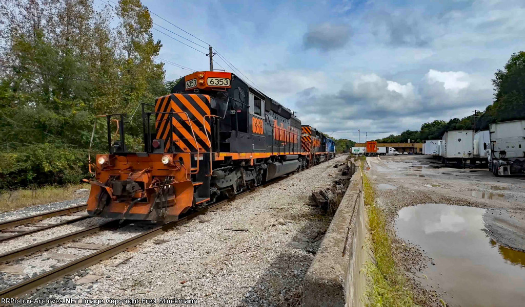 WE 6353 leads the power for the stone train toward Summit St.